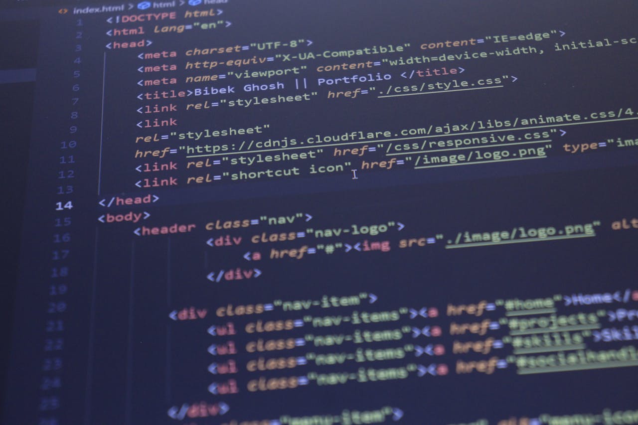 Close-up view of HTML and CSS code displayed on a computer screen, ideal for programming and technology themes.